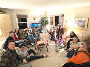 adulting group meeting in a living room